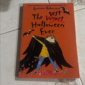 Scholastic Orange Halloween Book Cover with Black Cape Illustration